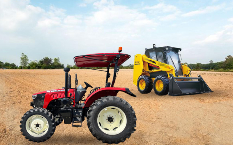  A red tractor and a yellow skid steer operating side by side in a field.