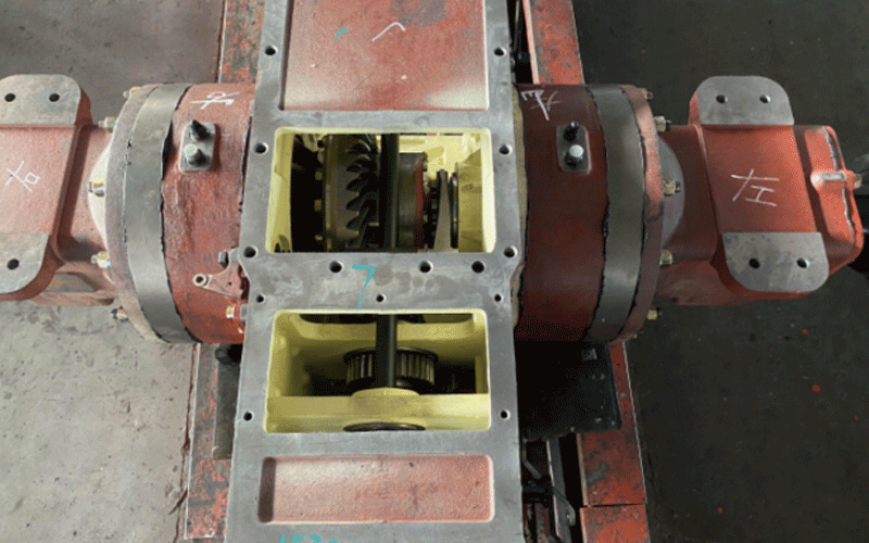 Top view of a red tractor gearbox.